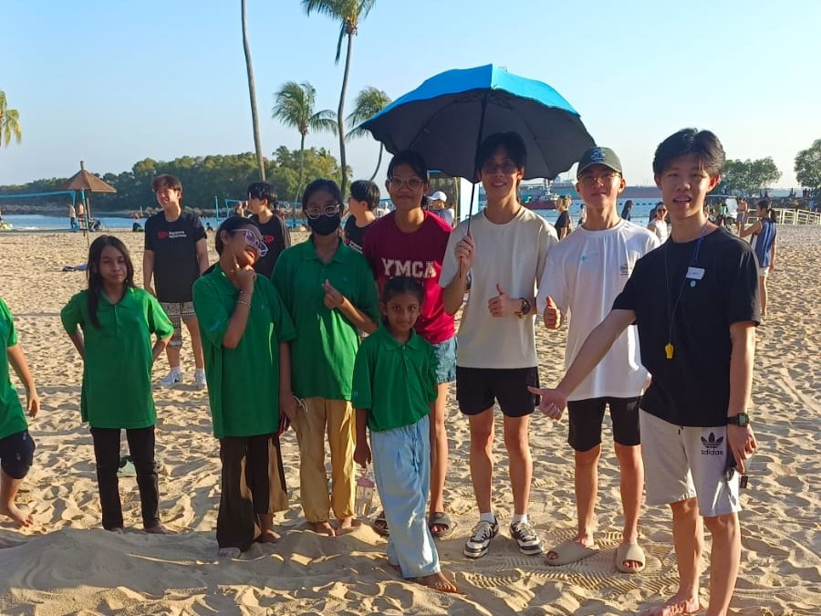 Volunteers on the beach at Sentosa