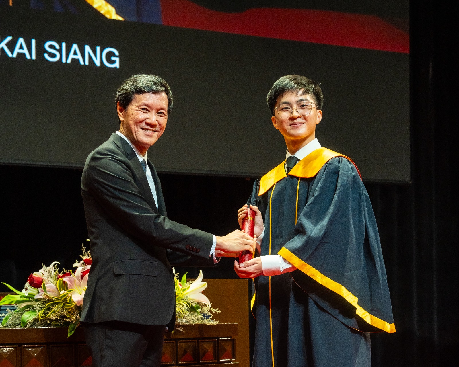 Receiving my diploma on stage at the Singapore Polytechnic graduation ceremony